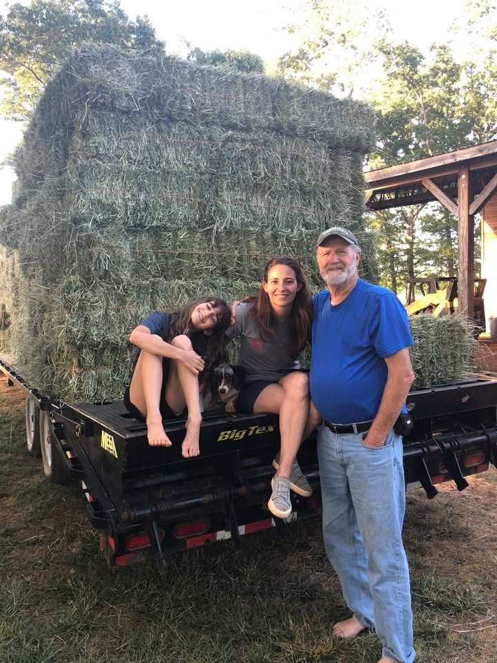 The Terry family on a stacked hay trailer at Warbridge Farm